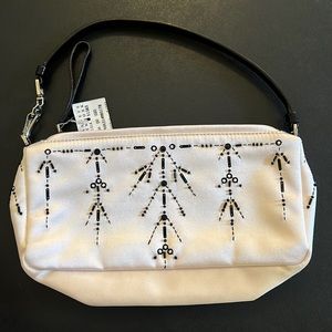 Small bag with a soft color of white and a bit of very light pink.